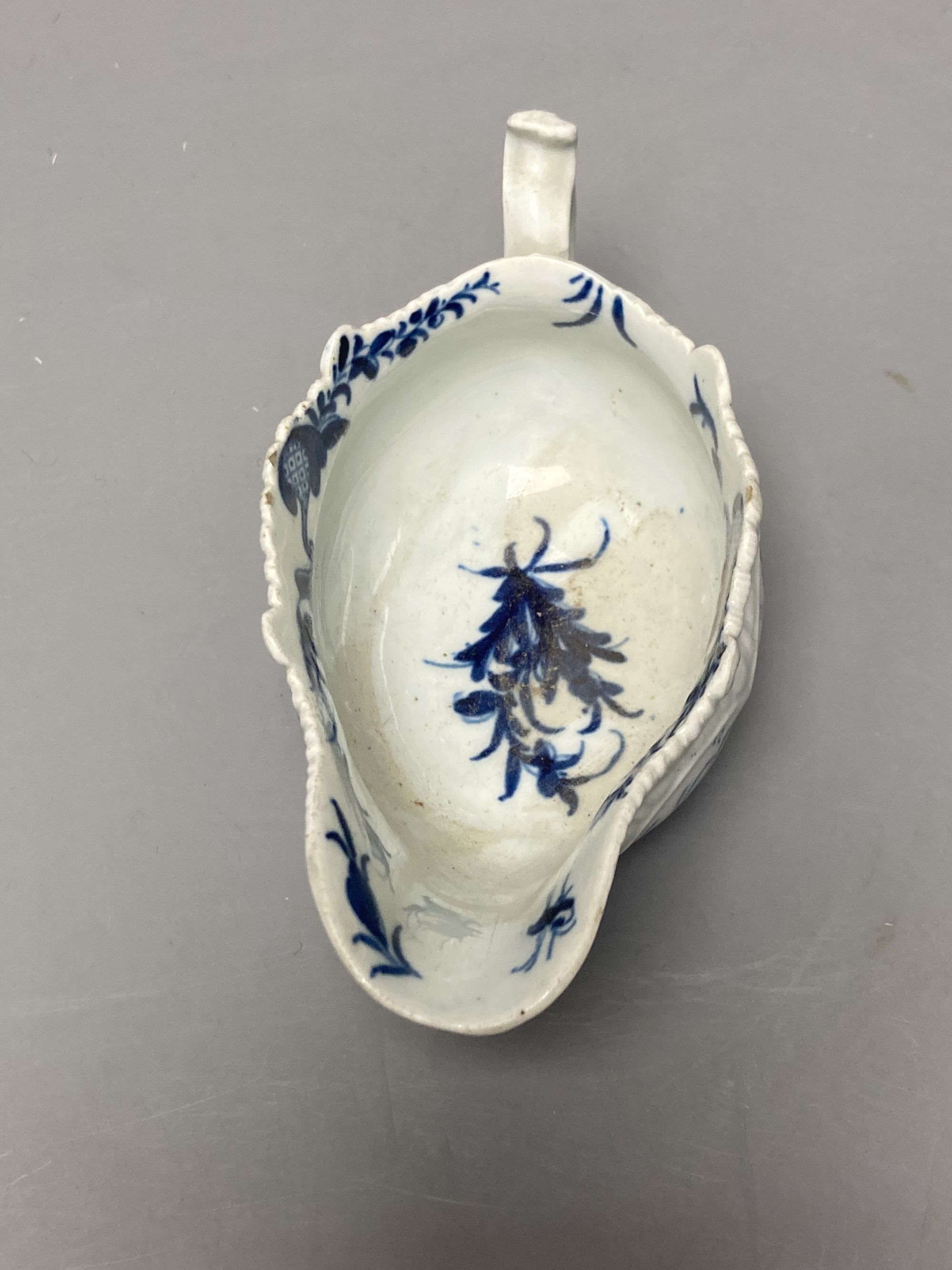 A Worcester Two Porter pattern blue and white small sauceboat circa 1760-5, workman's mark, length 13cm